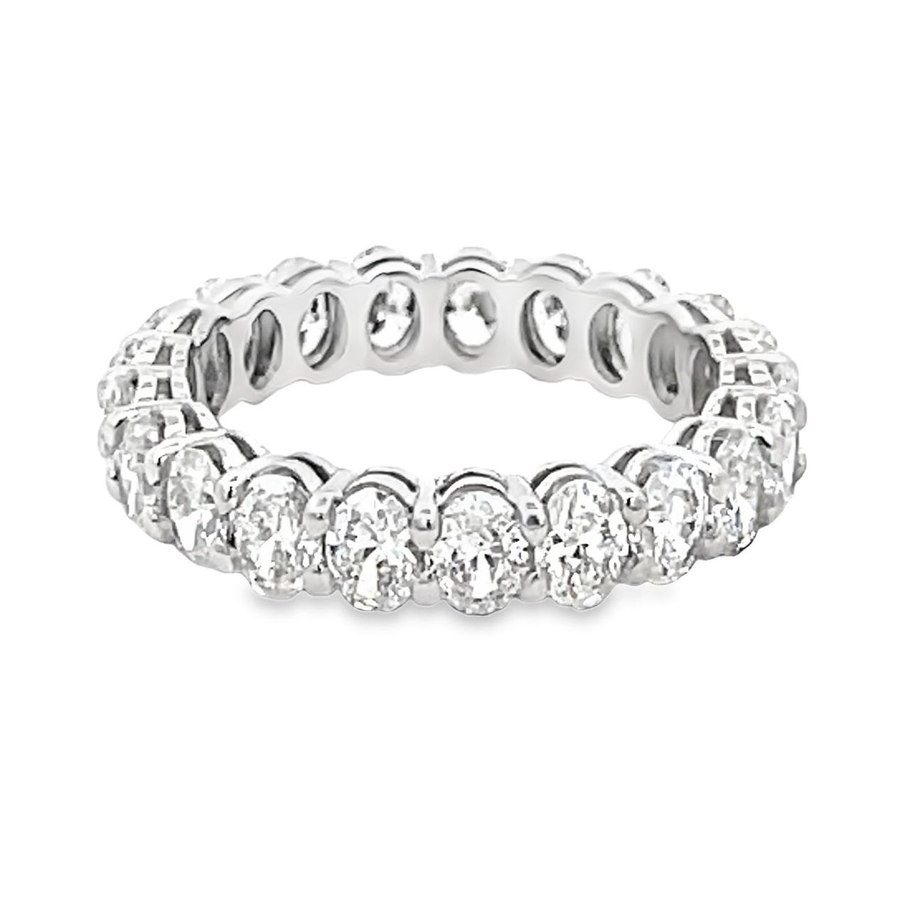 Eternity band in platinum with open basket prong set (21) oval diamonds.  D2.79ct.t.w.  Size 5.5