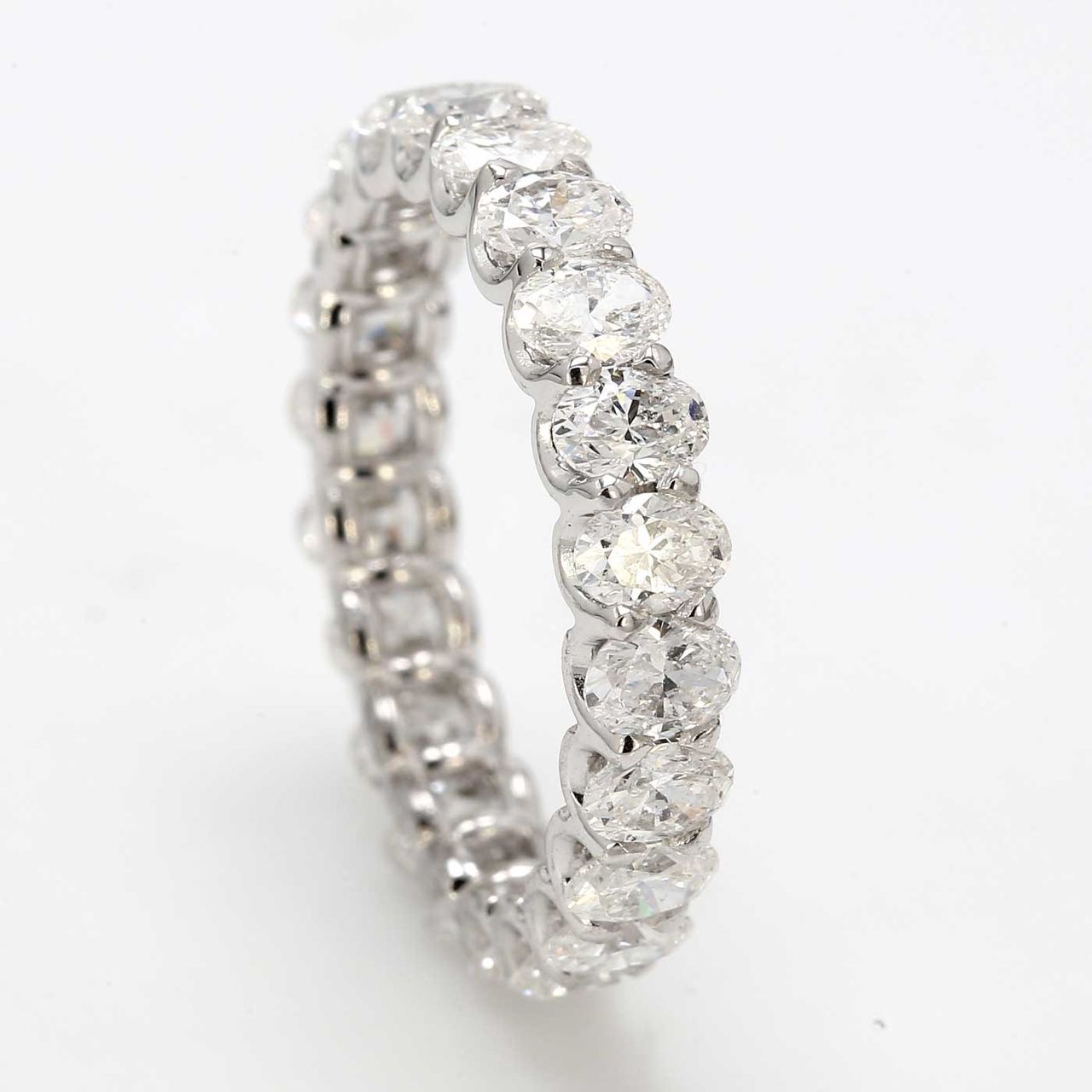 Eternity band with shared U-prong set E-F/VS+ (22) oval diamonds.  D2.97ct.t.w.  Size 6