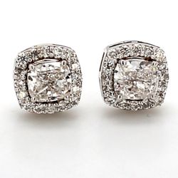Push back halo stud earrings with prong set rounds around GIA certified E/SI1 cushion cut diamond center.  D1.53ct.t.w.  (Center - 1.20ct.)