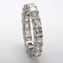 Eternity band in platinum with shared basket prong set (19) asscher cut diamonds.  D3.88ct.t.w.  Size 6.5