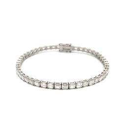 7' Tennis bracelet east west style in 18K WG with basket prong set (48) emerald cut diamonds.  D6.97ct.t.w.