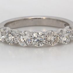 7-stone band in platinum with shared prong set round diamonds.  D1.31ct.t.w.  Size 6