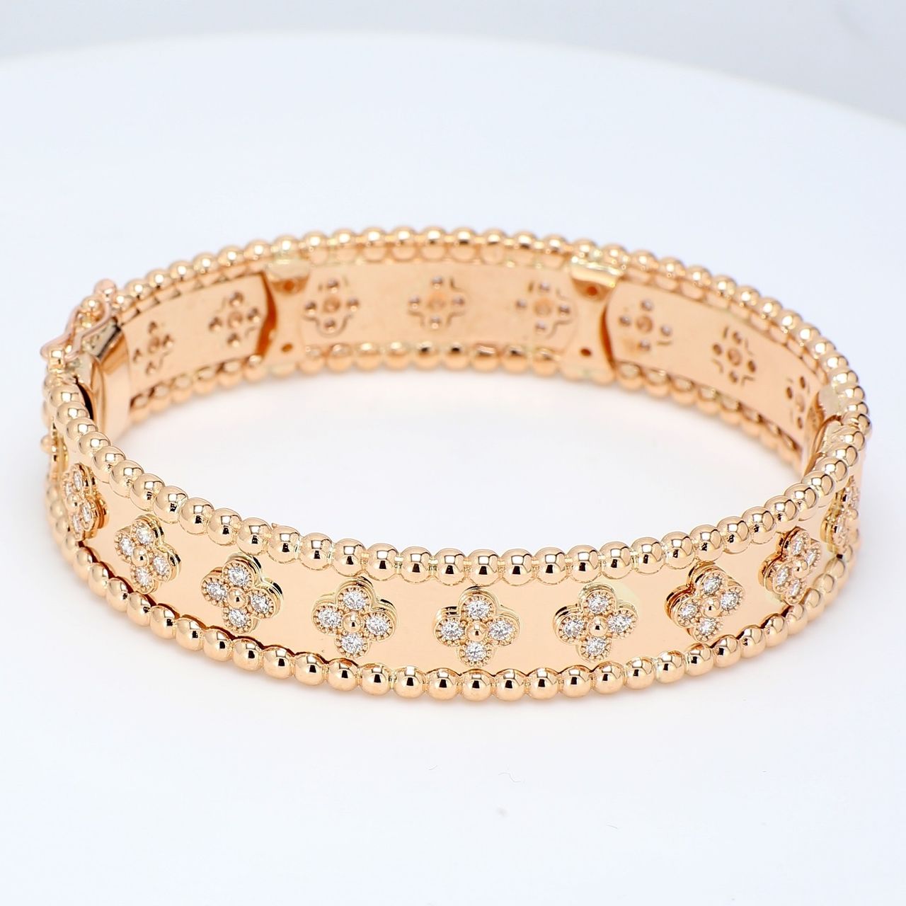 Flower bangle in 14K RG with bezel set (80) round diamonds.  D2.02ct.t.w.