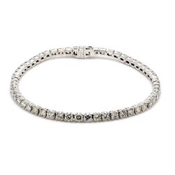 7' Tennis bracelet with crown head prong set (55) round diamonds.  D5.38ct.t.w.