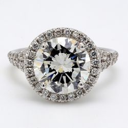 Halo split shank semi-mount in 18K WG with prong set round diamonds.  D0.58ct.t.w.
