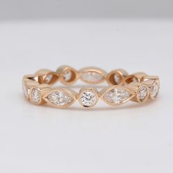 Eternity band in 14K RG with alternating bezel set round & marquise diamonds.  D0.95ct.t.w.  Size 4.5
