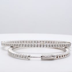 2' Inside out hoop earrings with shared prong set round diamonds.  D2.37ct.t.w.