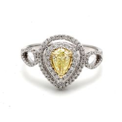 Double halo curved split-shank ring in 18K WG with French pave set rounds around a 3-prong set fancy yellow pear shape diamond center.  D0.78ct.t.w.  (Center 0.51ct.)