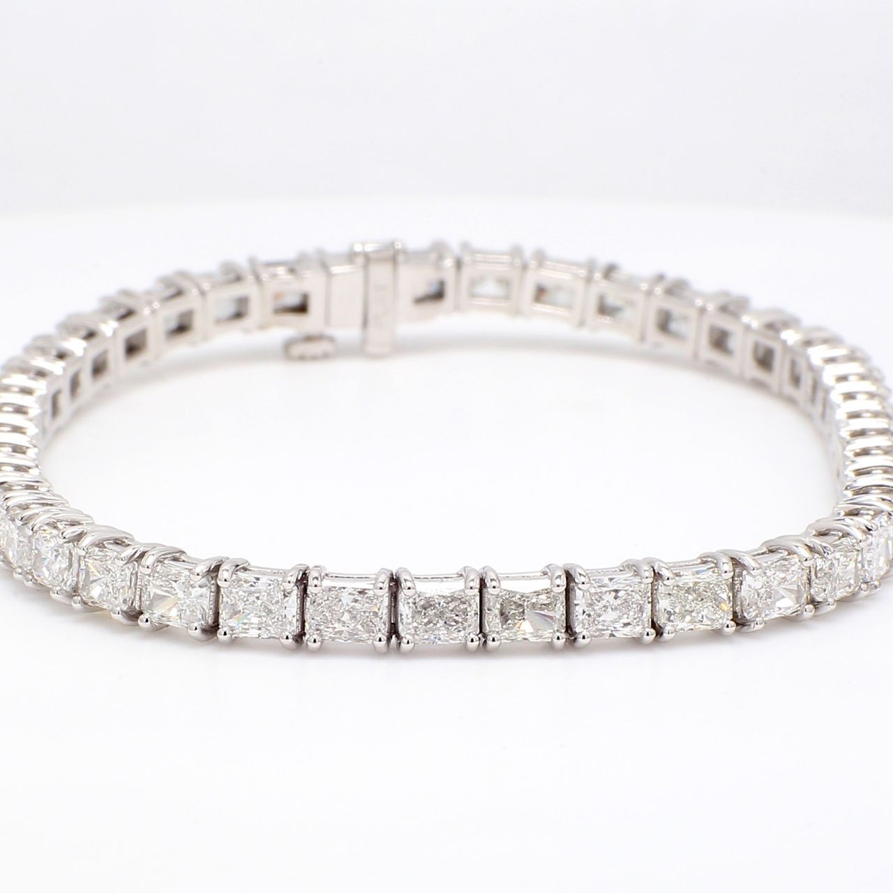 7' Tennis bracelet east to west style in platinum with double basket prong set radiant cut diamonds.  D10.52ct.t.w.