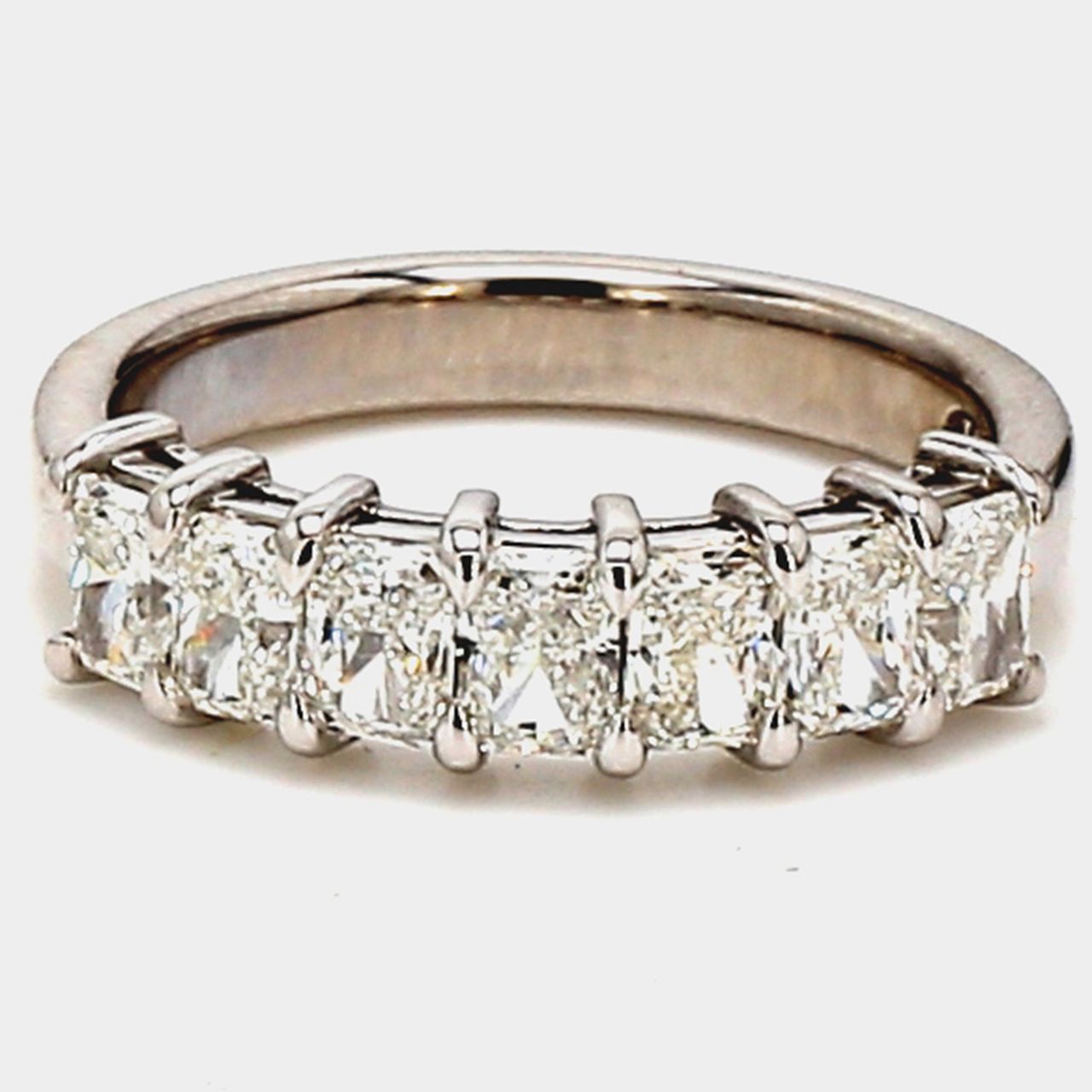 7-stone band in platinum with basket prong set radiant cut diamonds.  D1.42ct.t.w.  Size 6