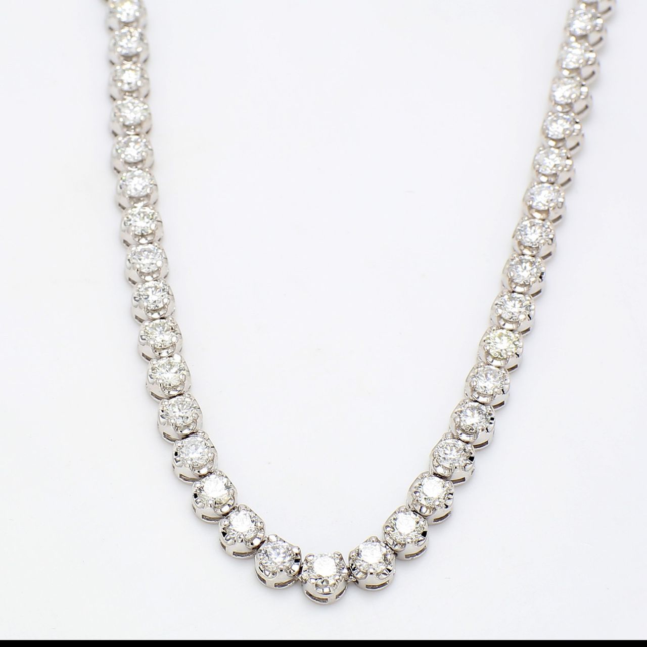 17' Straight line illusion tennis necklace with 4-prong set round diamonds.  D16.32ct.t.w.