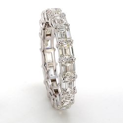 Eternity band east to west style with basket prong set (17) emerald cut diamonds.  D5.16ct.t.w.  Size 7.5