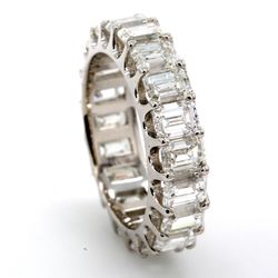 Eternity band in platinum with U-prong set (20) emerald cut diamonds.  D4.76ct.t.w.  Size 5.5