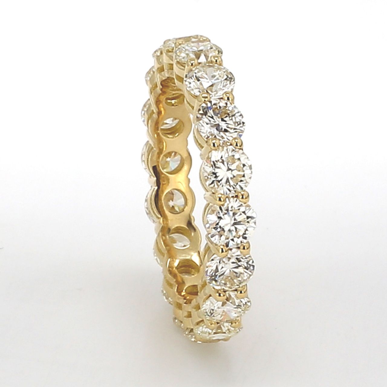 Eternity band in 18K YG with basket prong set (18) round diamonds.  D4.12ct.t.w.  Size 7.25