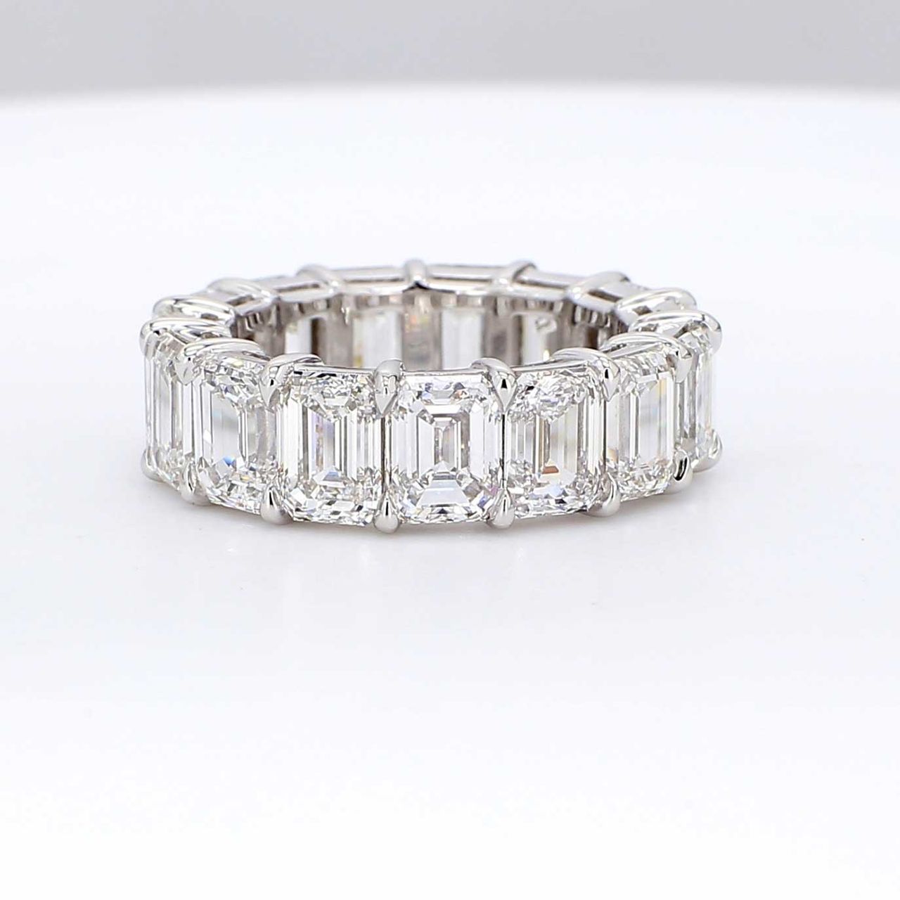 Eternity band in platinum with double basket shared prong set GIA certified D-F/IF-VVS2 (15) emerald cut diamonds.  D10.58ct.t.w.  Size 5