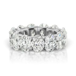 Eternity band in platinum with U-prong set oval diamonds.  D5.52ct.t.w.  Size 7.25