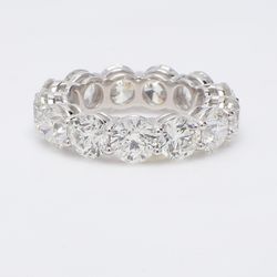 Eternity band in platinum with shared prong set round diamonds.  D9.16ct.t.w.