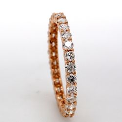 Eternity band in 14K RG with U-prong set (28) round diamonds.  D0.83ct.t.w.  Size 4.75