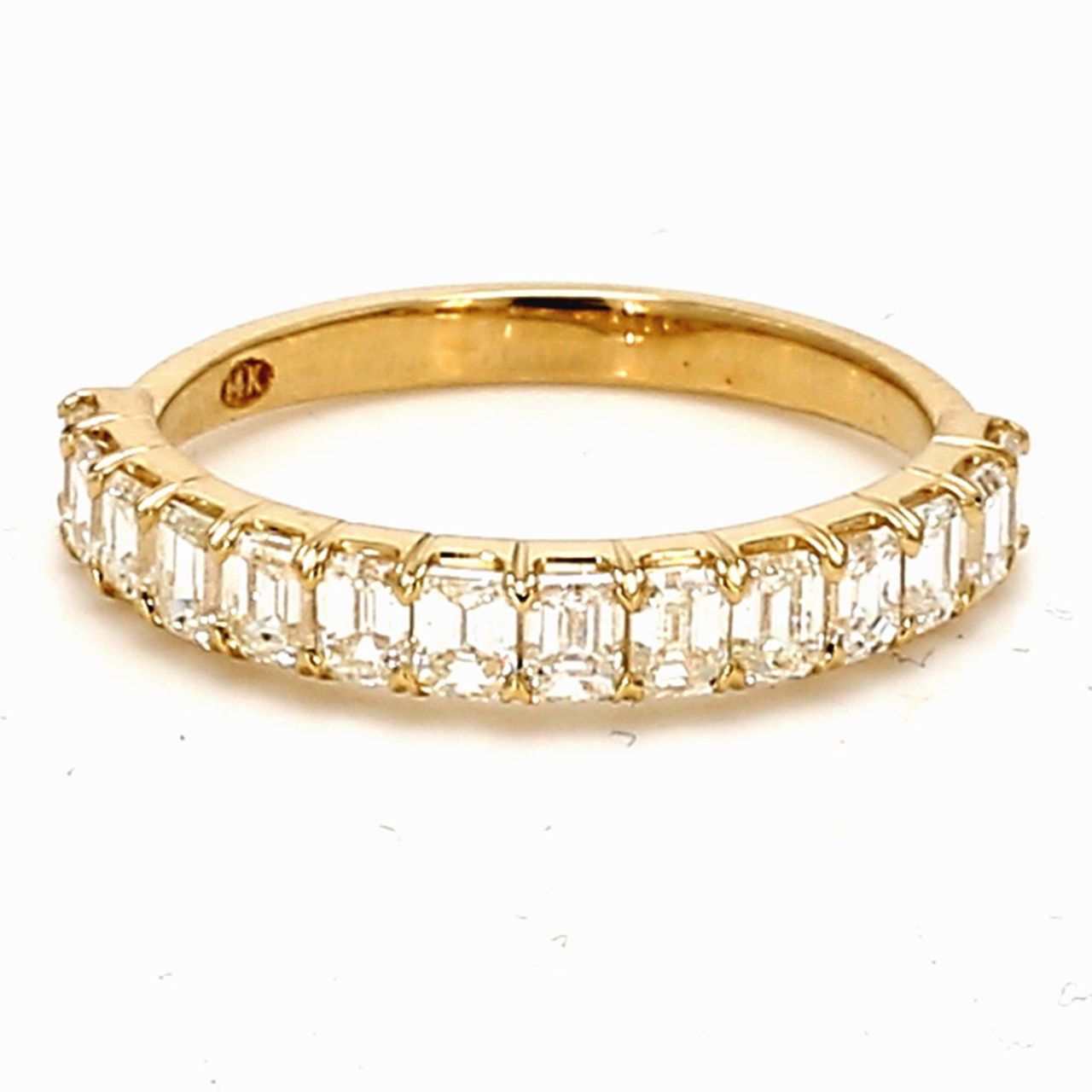 Single row band in yellow gold with prong set (14) emerald cut diamonds.  D1.23ct.t.w.  Size 6