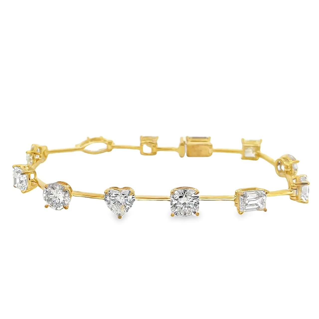 7' Bar style bracelet in 18K YG with basket prong set (12) multi-shape diamonds.  D12.68ct.t.w.