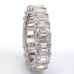 Eternity band in platinum with basket claw set GIA certified G-I/VVS1-VS2 (19) emerald cut diamonds.  D7.77ct.t.w.  Size 7