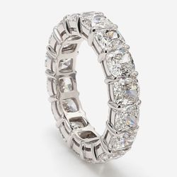 Eternity band in platinum w/ claw prong set GIA certified E-G/SI1 (16) cushion cut diamonds.  D8.52ct.t.w.  Size 7.5