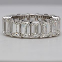 Eternity band in platinum with eagle claw basket set GIA certified H-I/IF-VS2 (17) emerald diamonds.  D12.33ct.t.w.  Size 6.25