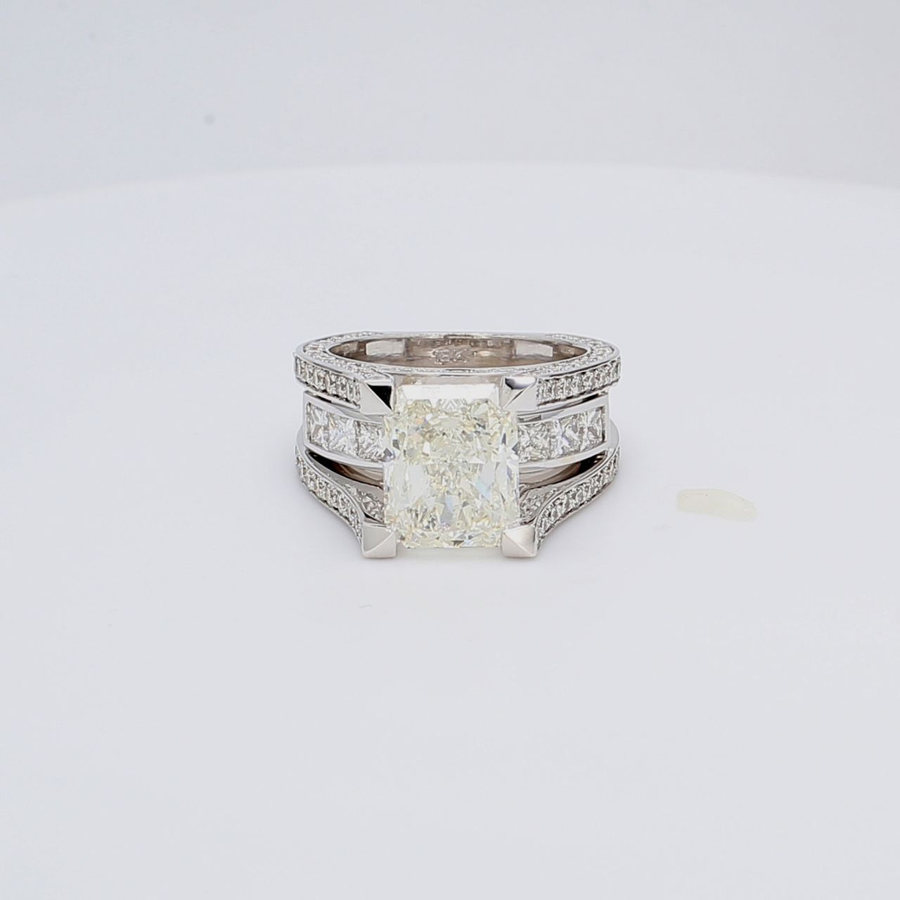 Semi-mount with channel princess cuts & pre-set round diamonds.  D2.29ct.t.w.  Size 6.5