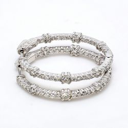 1.25' Inside out hoop earrings with prong set round diamonds.  D2.07ct.t.w.