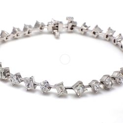 7' Bracelet in platinum with claw prong set mixed fancy shaped diamonds.  D6.56ct.t.w.