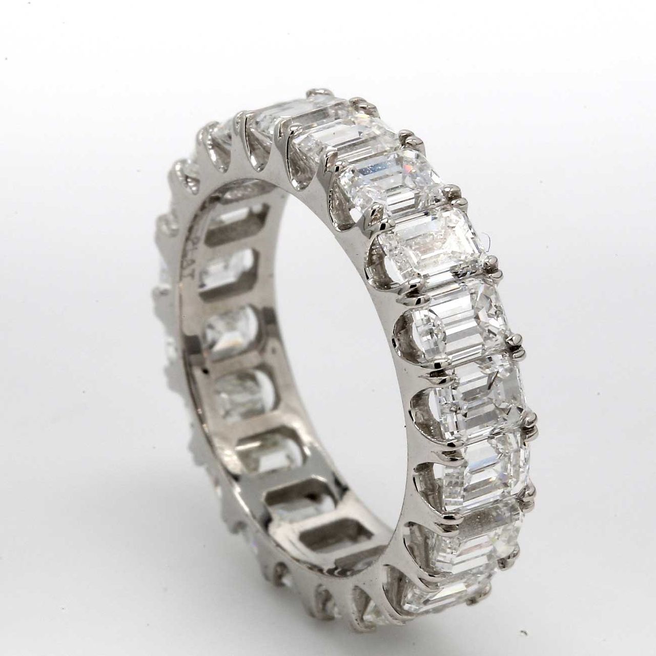 Eternity band in platinum with basket U-prong set (20) emerald cut diamonds.  D6.30ct.t.w.  Size 5
