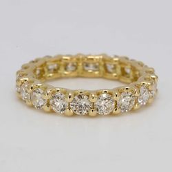Eternity band in 18K YG with U-prong set round diamonds.  D3.33ct.t.w.  Size 7.5