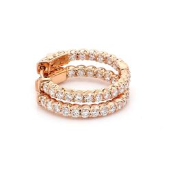 1' Inside out hoop earrings with shared prong set round diamonds.  D1.42ct.t.w.