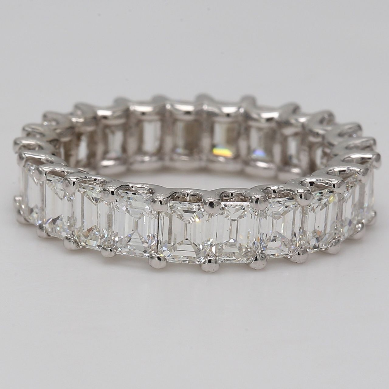 Eternity band with U-prong set (23) emerald cut diamonds.  D4.74ct.t.w.  Size 6.75