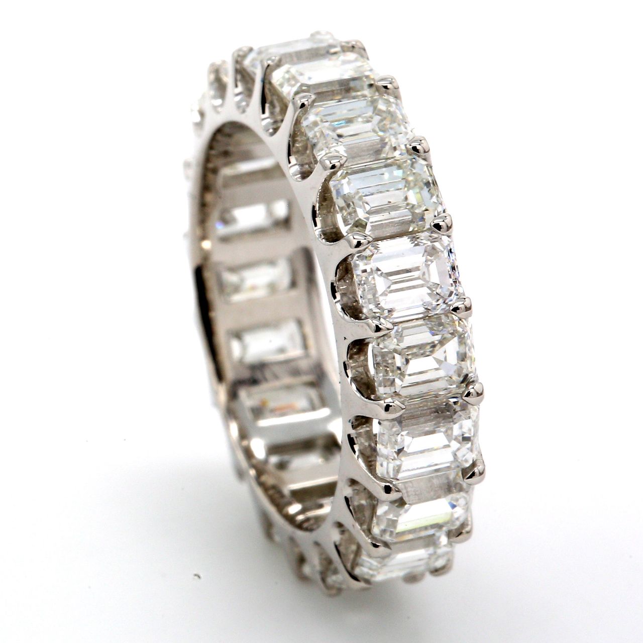 Eternity band in platinum with U-prong set (20) emerald cut diamonds.  D4.76ct.t.w.  Size 5.5
