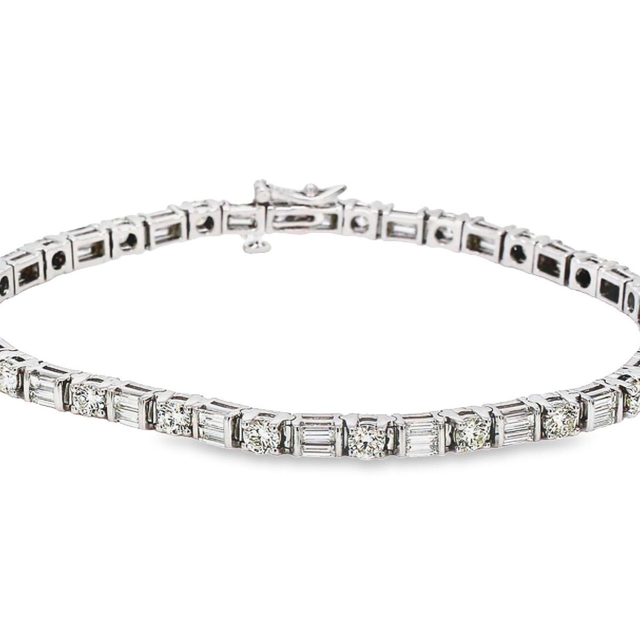 8' Tennis bracelet with alternating basket prong set (22) rounds and (44) baguette diamonds.  D5.66ct.t.w.