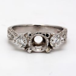 3-stone designer semi-mount with round diamonds.  D1.34ct.t.w.