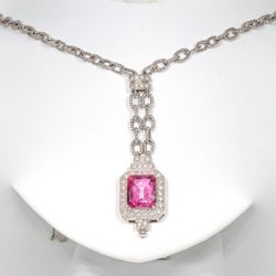 Necklace with pave set round diamonds and prong set pink topaz center stone.  D0.45ct.t.w.  Topaz 8.00ct.