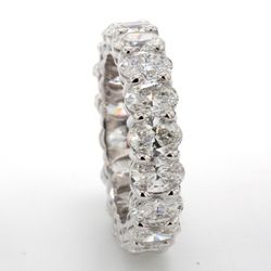 Eternity band in platinum with basket prong set (18) oval diamonds.  D4.32ct.t.w.  Size 5