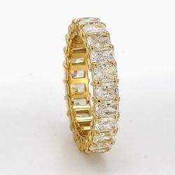 Eternity band in 18K YG with basket prong set (23) radiant cut diamonds.  D1.73ct.t.w.  Size 5