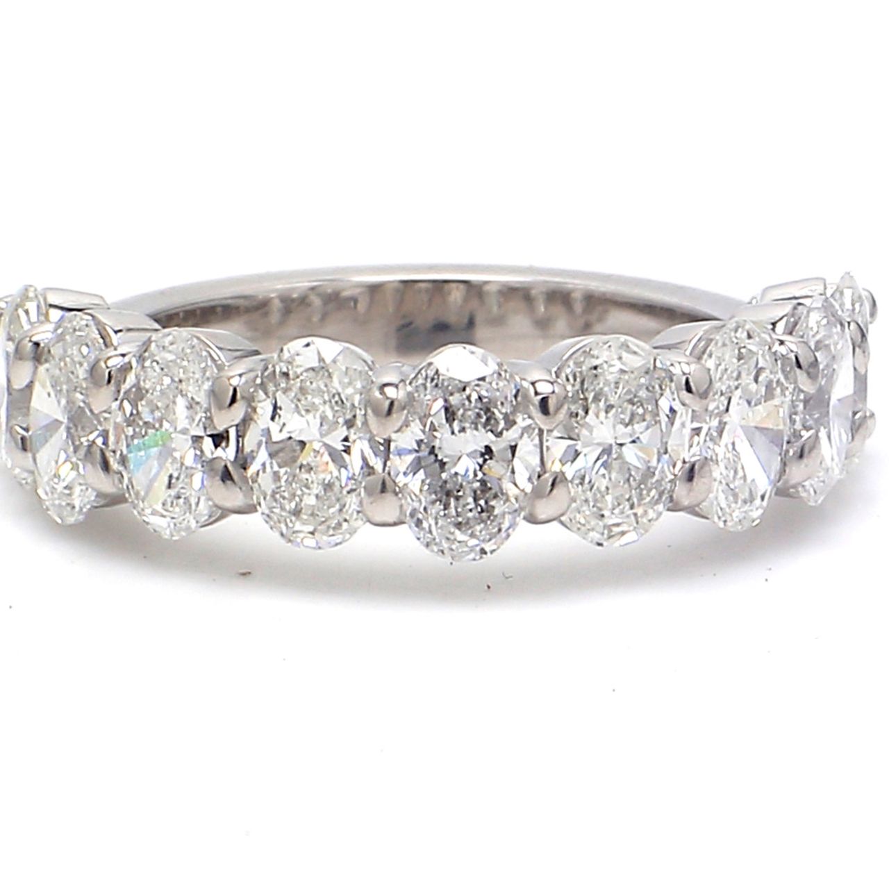 9-stone band in platinum with basket prong set oval cut diamonds.  D2.43ct.t.w.  Size 5.5