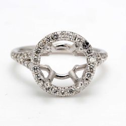 Halo split shank semi-mount with shared prong set round diamonds.  D0.45ct.t.w.