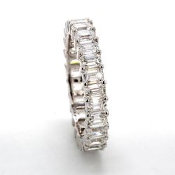 Eternity band with shared prong set (25) emerald cut diamonds.  D2.98ct.t.w.  Size 6