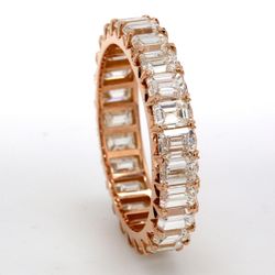 Eternity band in 18K RG with prong set (25) emerald cut diamonds.  D4.58ct.t.w.  Size 7.5