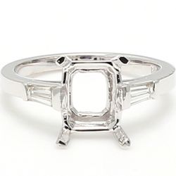 3-stone semi-mount in 18K WG with tapered baguette diamond sides.  D0.23ct.t.w.