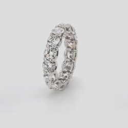Eternity band in platinum with shared u-prong set E-F/VS1-SI1 (15) round diamonds.  D5.47ct.t.w.  Size 7.25