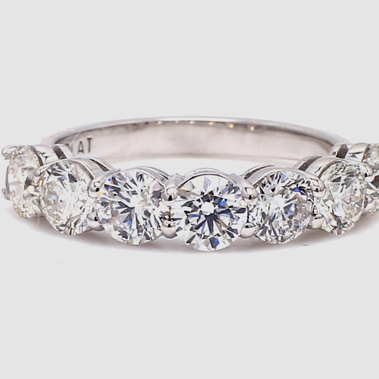 7-stone band in platinum with basket prong set round diamonds.  D1.65ct.t.w.  Size 4.75