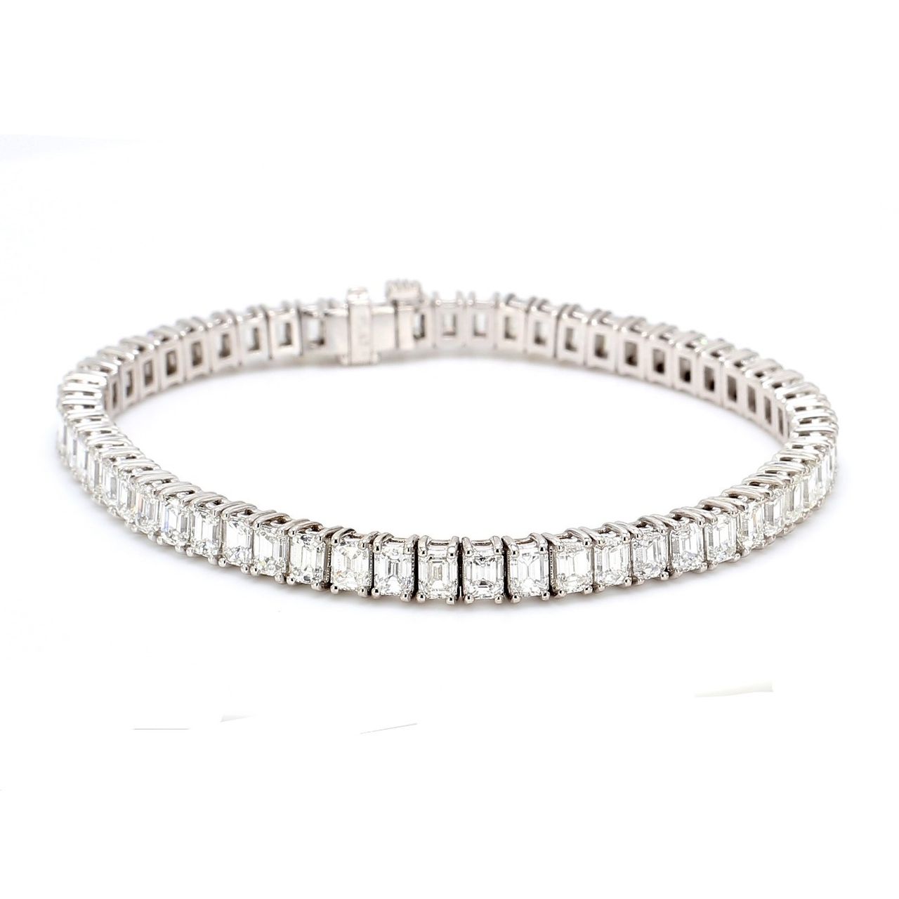7' Tennis bracelet in platinum with basket prong set (58) emerald cut diamonds.  D11.33ct.t.w.