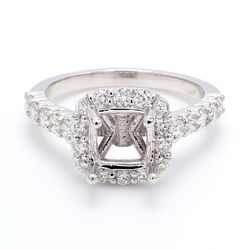 Halo semi-mount with bezel set & 4-prong set round diamonds.  D0.81ct.t.w.  Size 6.25