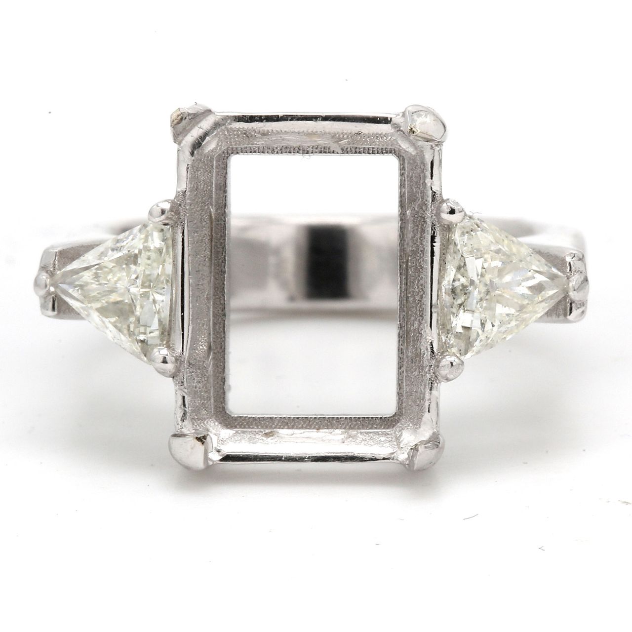 3-stone semi-mount with eagle claw prong setting for center and trilliant diamond sides.  D1.02ct.t.w.  Size 9